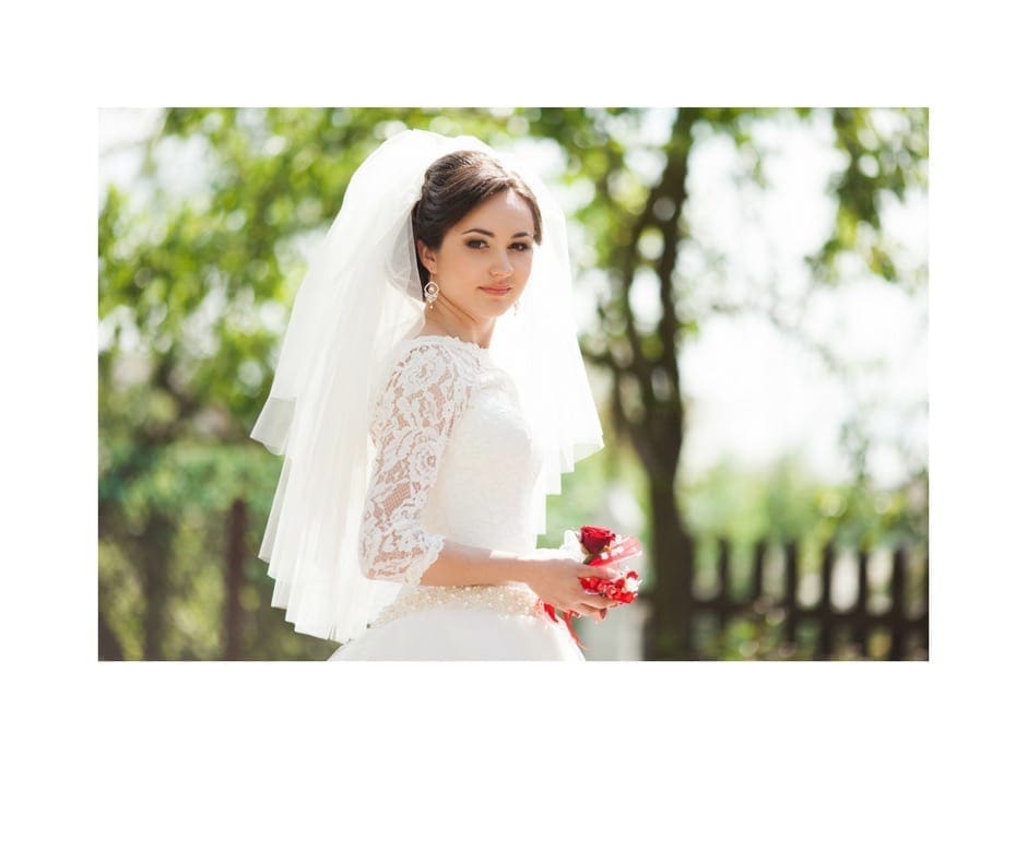 beautiful bride at an outdoor wedding, wonderful lace beading on wedding dress