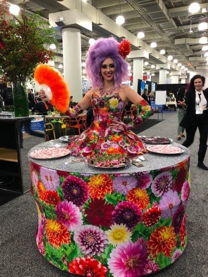 Woman wearing table-dress with mints to hand out at bizbash ny