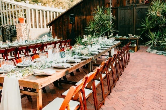 Farm Tables at an outdoor event. Photo by Nola Fontanez.