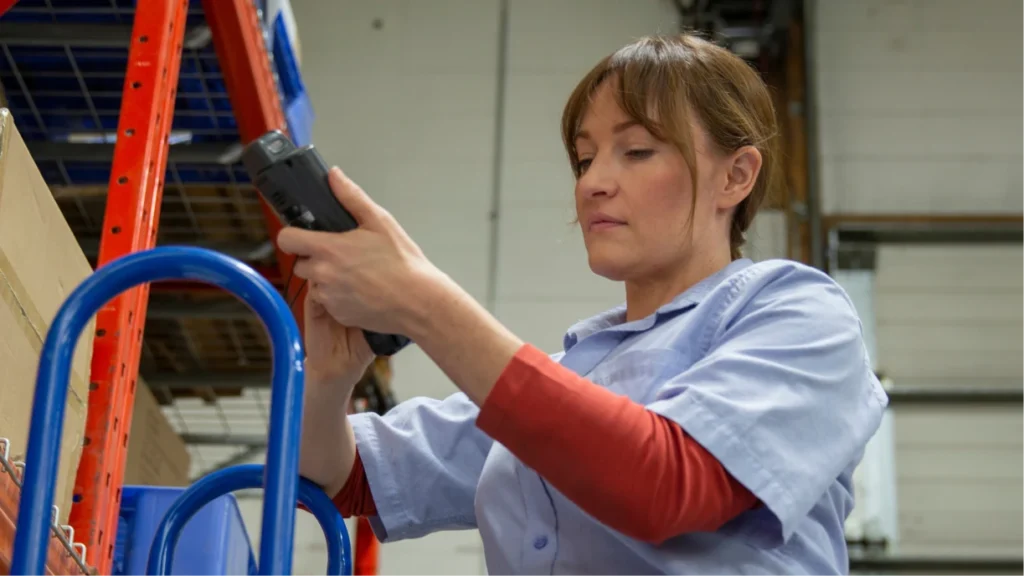 Event rental worker frustrated with broken traditional barcode scanner.