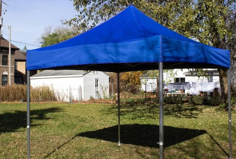 blue pop-up tent for backyard party