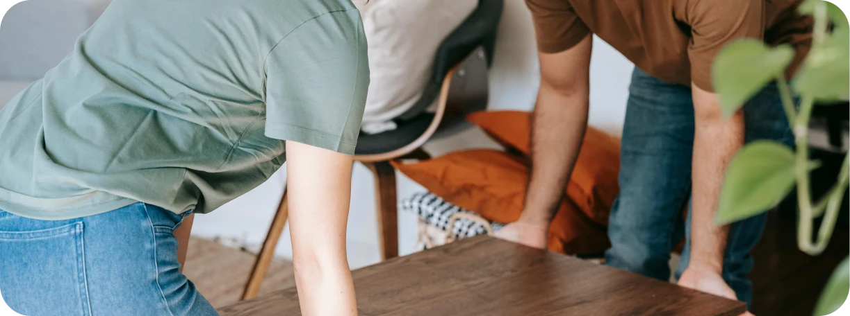 Event staff setting up equipment at a venue, highlighting activities covered by general liability insurance