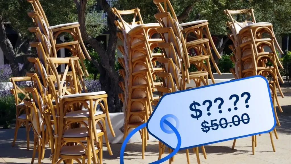 Stack of chiavari chairs with price tags showing increased costs due to tariffs