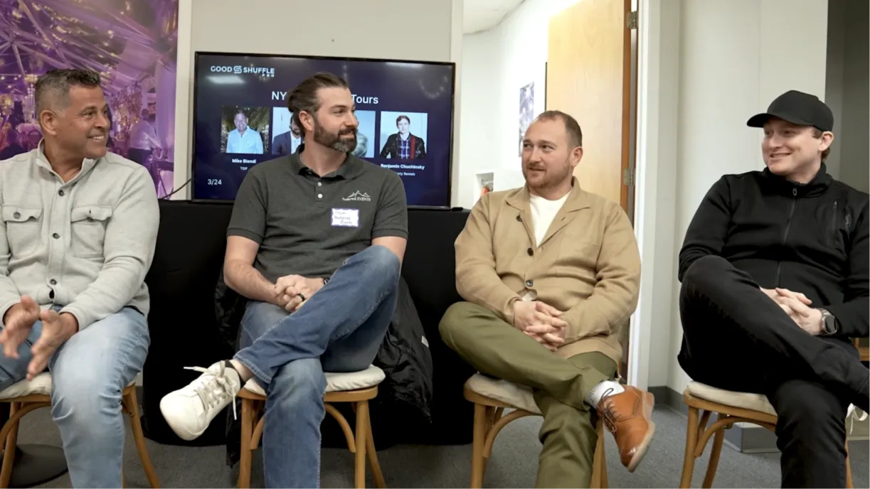 Four event rental and tenting operators seated at a roundtable discussion at a Long Island warehouse event