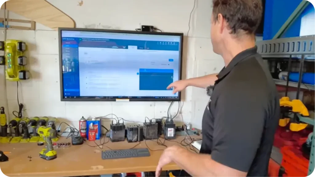 A touchscreen loading station showing a digital pull sheet in the warehouse