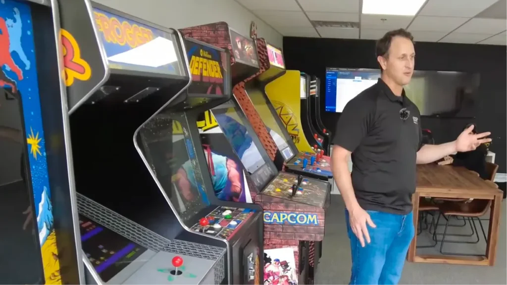 Arcade games and photo booths stored in an organized event rental warehouse