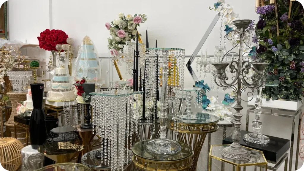 Event decor and rental pieces organized on warehouse shelves