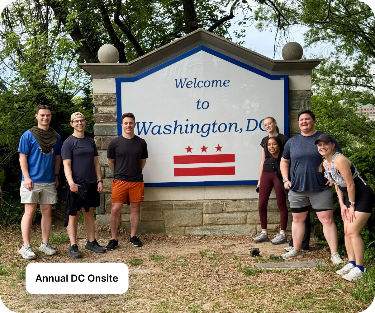 Goodshuffle teammates at the Welcome to Washington, DC sign during the annual team onsite